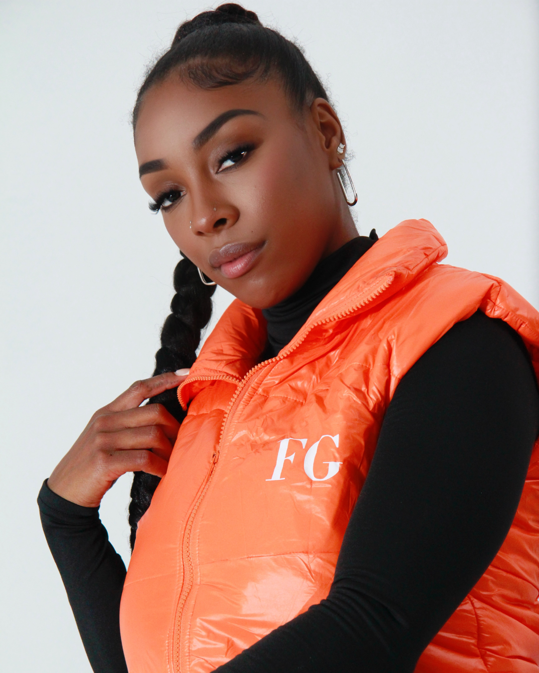 Close-up of FG logo on front of vest