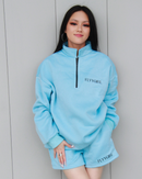 Model wearing NYLA zip-up sweatsuit front view