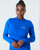 Model wearing blue Nova Bodysuit zipped to collarbone