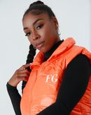 Close-up of FG logo on front of vest