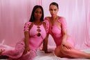 Lingerie-inspired pink one-piece for soft life fashion