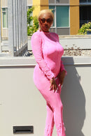 Side view highlighting the figure-hugging silhouette of RIHANNA bodysuit