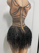 Close-up of crystal tassel detailing on bodysuit