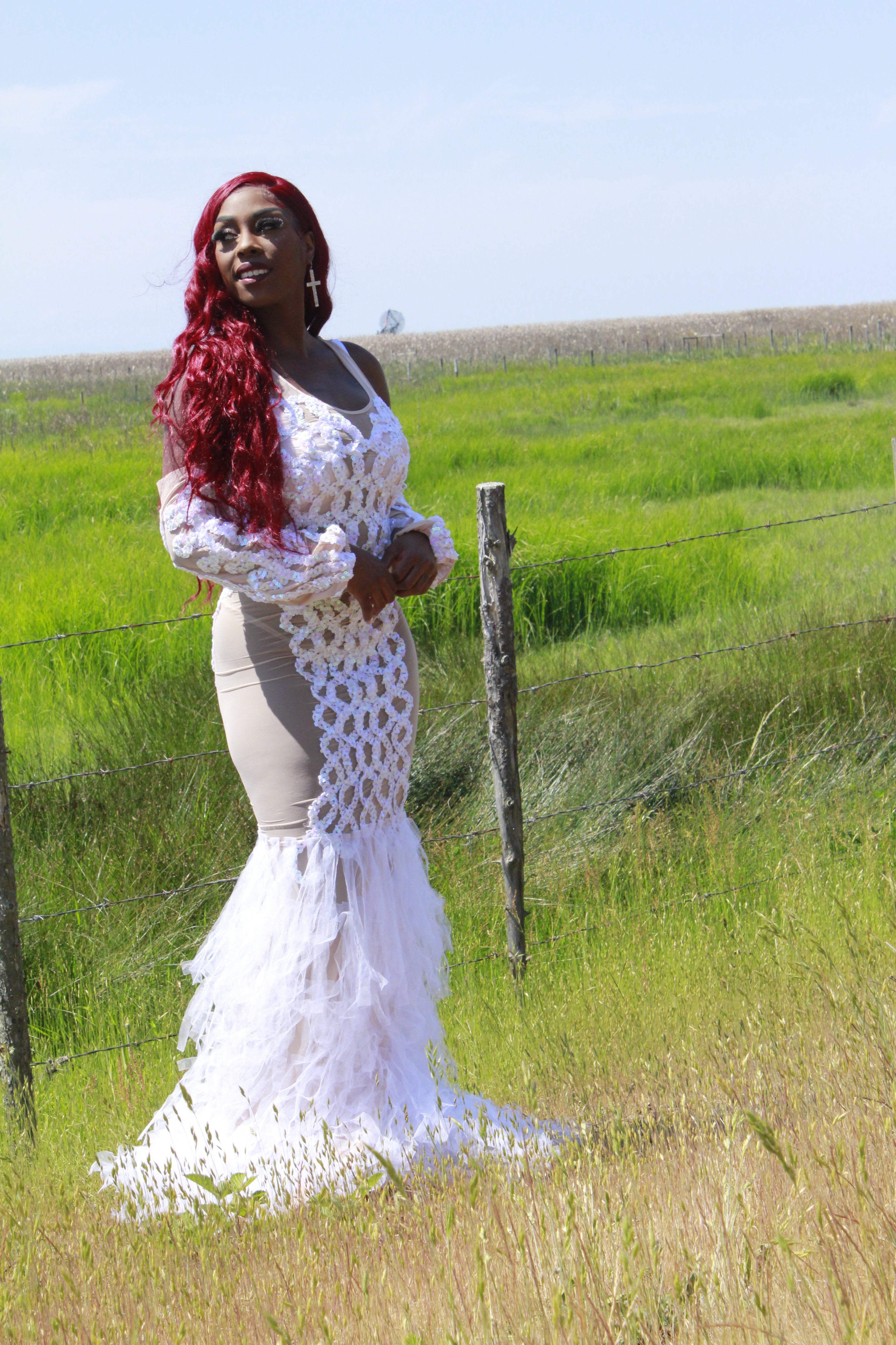 Side view showing alluring sheer fabric panels of LYNA dress