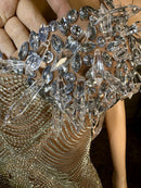 Close-up of rhinestone detailing on mesh fabric