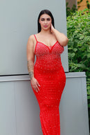 Model wearing STEPHANIE red full-length backless beaded dress