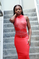 Model wearing ZENYA full-length red jewel neck beaded and sequined dress
